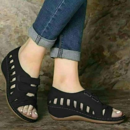 Buckal Black Wedge Sandals.
